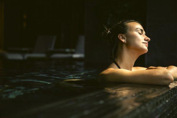 attractive-young-woman-black-swimsuit-is-relaxing-pool_1